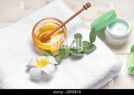 Composition with spa items and honey on white background Stock Photo