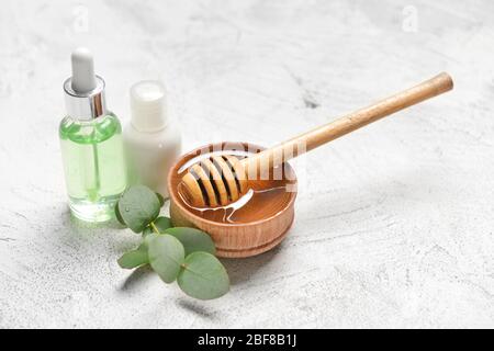 Spa items and honey on light background Stock Photo