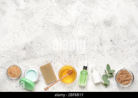 Composition with spa items and honey on light background Stock Photo