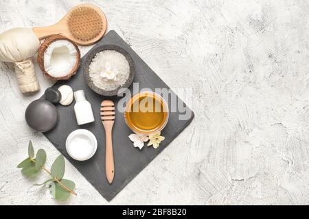 Composition with spa items and honey on light background Stock Photo