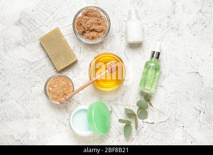 Composition with spa items and honey on light background Stock Photo