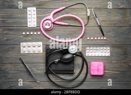 First aid kit on wooden background Stock Photo