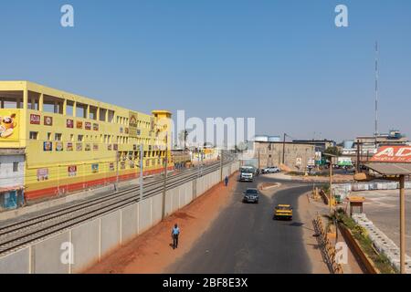 DAKAR, SENEGAL - NOVEMBER 11, 2019: People working and traffic at Senegal capital Dakar, West Africa. Stock Photo