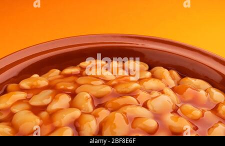 Ceramic clay plate with baked beans in tomato sauce Stock Photo