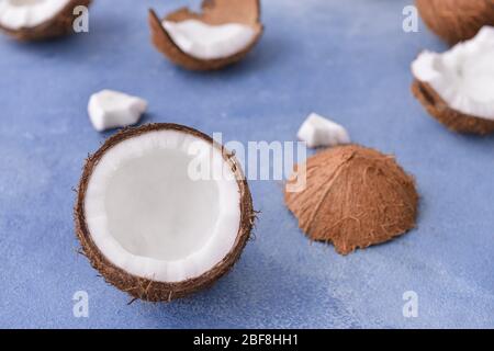 Ripe coconuts on color background Stock Photo