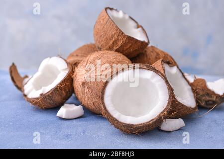 Ripe coconuts on color background Stock Photo