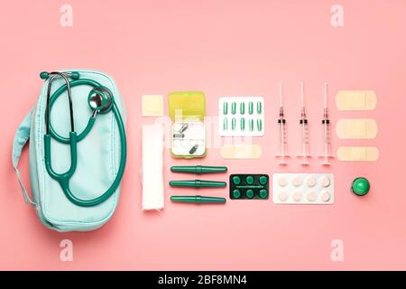 First aid kit on color background Stock Photo