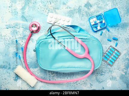 First aid kit on color background Stock Photo