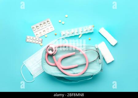 First aid kit on color background Stock Photo