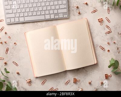 Notebook with computer keyboard on light background Stock Photo