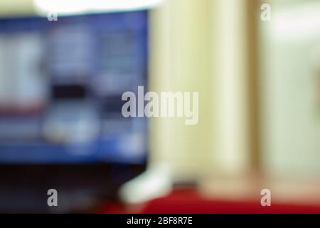Defocused Blurred desktop background with laptop screen. Copy space office Stock Photo
