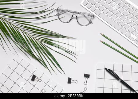 Set of school supplies with computer keyboard and eyeglasses on white background Stock Photo
