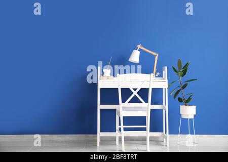 Modern workplace near color wall Stock Photo