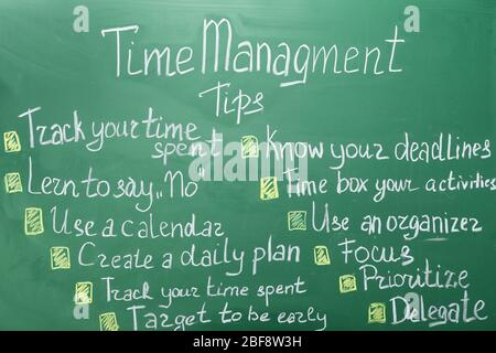 Time management tips written on chalkboard Stock Photo
