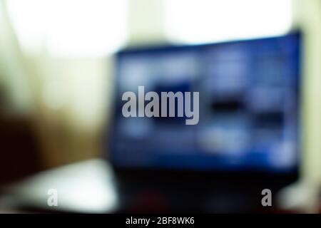 Office laptop desktop on a table indoors for copy space. Background Interior for text Stock Photo