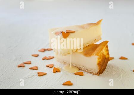 Parisian Flan French Custard Pie Classic tart. Baked confectionery cream in shortbread dough crust. Pie and two mini pies on dark background with Stock Photo