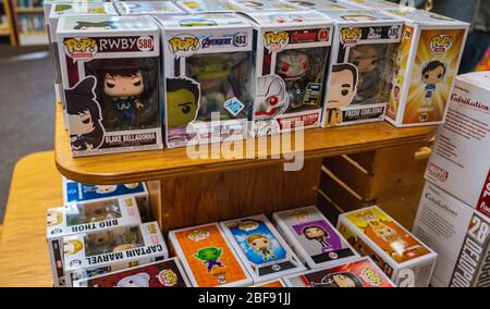 A table arranged with a stack of Funko Pop toys at a store. Stock Photo