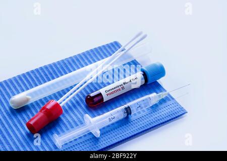 Remdesivir Against Coronavirus COVID-19 Medical Syringe with Vaccine Positive Coronavirus Blood test and Nasal Swab Laboratory Test. Stock Photo