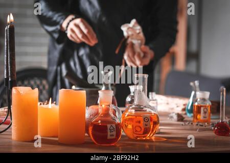 Male alchemist making elixir in laboratory Stock Photo