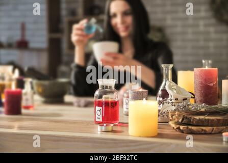 Female alchemist making elixir in laboratory Stock Photo