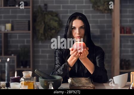 Female alchemist making elixir in laboratory Stock Photo