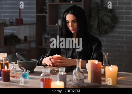 Female alchemist making elixir in laboratory Stock Photo