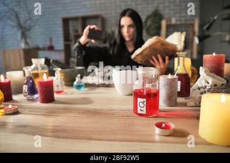 Female alchemist making elixir in laboratory Stock Photo