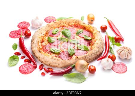 Tasty pizza with ingredients on white background Stock Photo