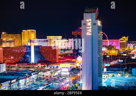 LAS VEGAS, NEVADA - FEBRUARY 23, 2020: Evening view across Las Vegas from above with lights and  resort casino hotels in view.