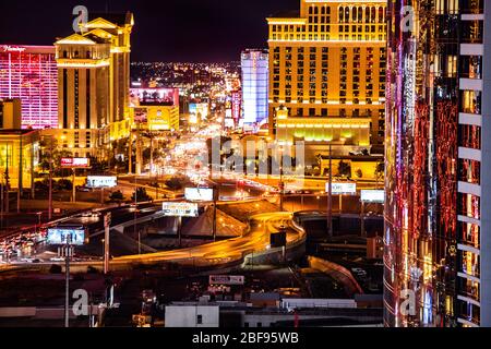 LAS VEGAS, NEVADA - FEBRUARY 23, 2020: Evening view across Las Vegas from above with lights and  resort casino hotels in view.