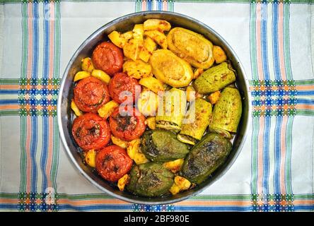 'Gemista' (or 'Yemista'), a traditional Greek food. Vegetables (tomatoes, ball peppers, potatoes etc.) filled with rice (sometimes also ground meat). Stock Photo