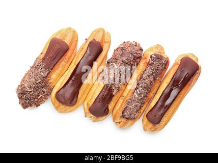 Tasty chocolate eclairs on white background Stock Photo