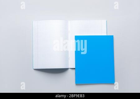 Two notebooks on grey background Stock Photo
