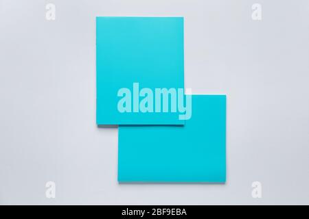Two notebooks on grey background Stock Photo