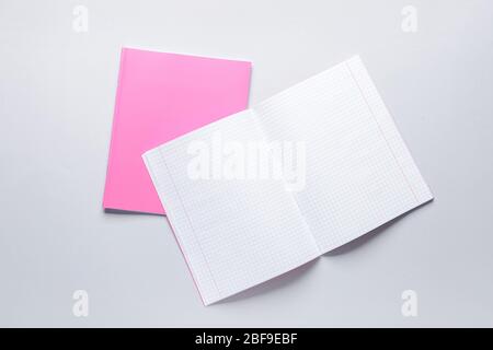 Two notebooks on grey background Stock Photo