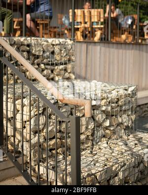 Wendover Woods Visitors Centre detail of gabion walls. Wendover Woods Visitor Centre, Aylesbury, United Kingdom. Architect: Re-Format, 2018. Stock Photo