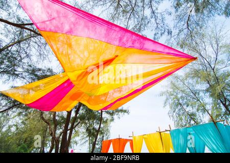 Colourful pastel elegant decor wedding venue set up outdoor with orchid flower and colorful table sheet for india wedding reception. Stock Photo