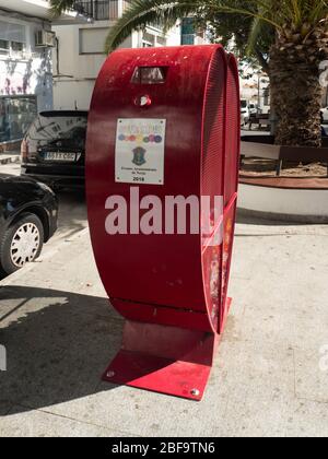 Heart shaped plastics recycling bin on road side. Stock Photo