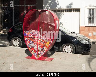 Heart shaped plastics recycling bin Stock Photo