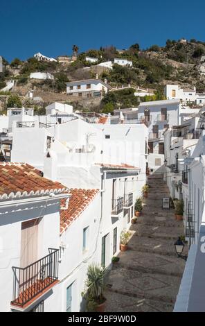 Street scene in Frigiliana, Andalusia, Spain, built on a hillside with white buildings. Stock Photo