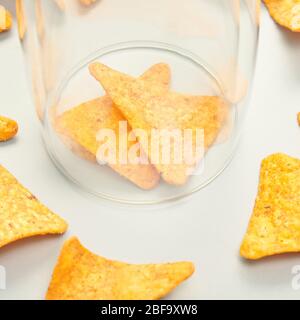 Isolation concept. Two chips into glass house Stock Photo