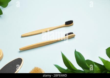Wooden tooth brushes on color background Stock Photo