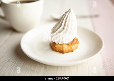 Coffee cup and cake with sparkler on the table Stock Photo