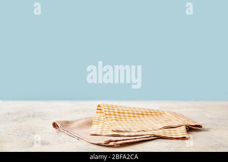 Napkin on table against color background Stock Photo