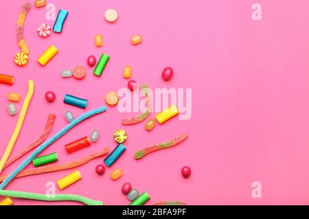 Assortment of sweet candies on color background Stock Photo