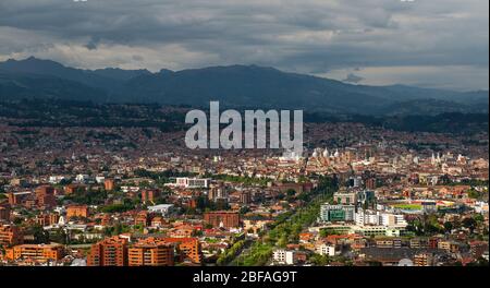 Aerial panorama of Cuenca city with the sun shining on the historic city center and its new cathedral, Ecuador. Stock Photo