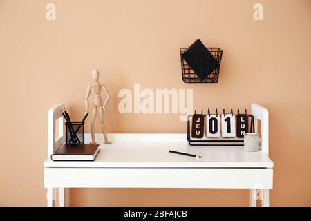 Modern stylish workplace near color wall Stock Photo