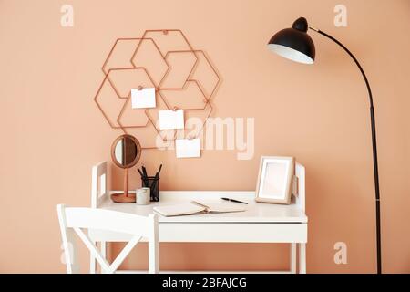 Modern stylish workplace near color wall Stock Photo