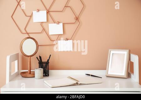 Modern stylish workplace near color wall Stock Photo