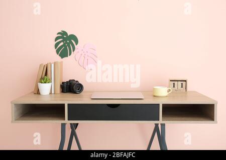 Modern stylish workplace near color wall Stock Photo
